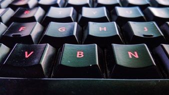 red letters on a black keyboard