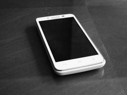 white smartphone cel