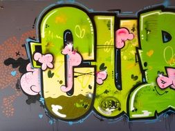 Bright graffiti in the form of green letters