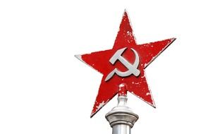 Red star with a sickle and a hammer on the spire