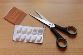 tablets plaster and scissors