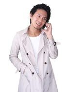 girl in a raincoat with a phone