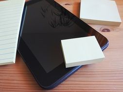 tablet and paper for notes