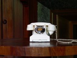 white old telephone on the table