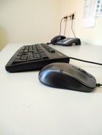 keyboard, mouse, phone on the desk