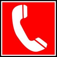 white phone receiver at red background