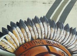 graffiti of feathered war bonnet