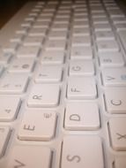 closeup side view of the white keyboard