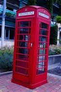 empty red phone booth in London