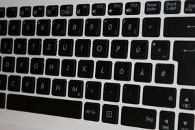 black laptop keyboard letters