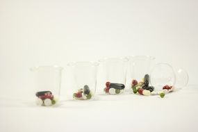 plastic cups with drugs doses
