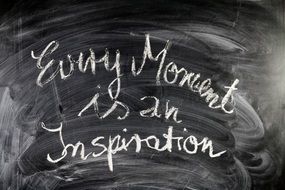 inscription on a blackboard about inspiration