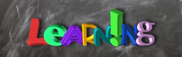 clipart of the learning word on a blackboard banner