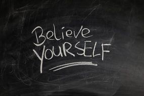 inscription on a blackboard about self confidence