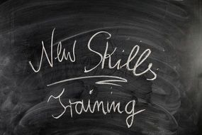 inscription on a blackboard about training new skills
