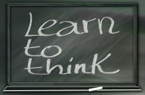 blackboard with text learn to think