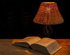 book in the light of a lamp