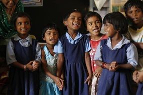 enthusiastic children in school uniform