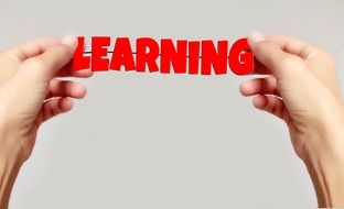 red inscription learning in hands