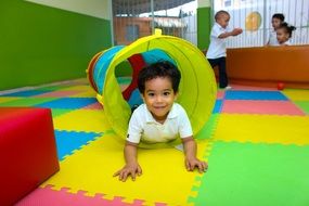 little boy plays in the playroom