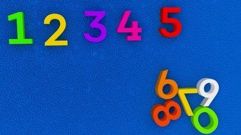 colorful numbers at blue surface