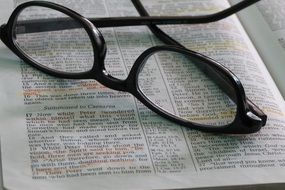 eyeglasses on open bible