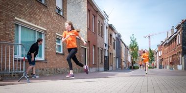 running schoolgirls at street