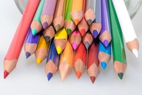 sharpened colour pencils in a glass