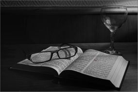 Glasses on the open book