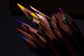 sharpened colour pencils at dark
