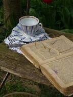 book with glasses near the cup