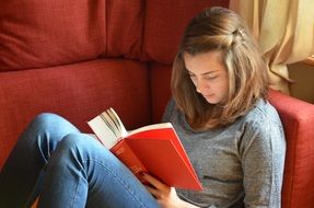 girl with a red open book