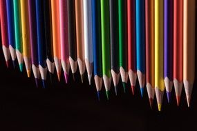sharpened colour pencils on the black background
