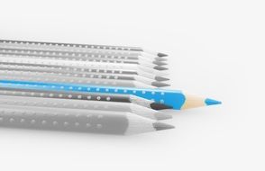 light blue pencil on black and white background of colored pencils