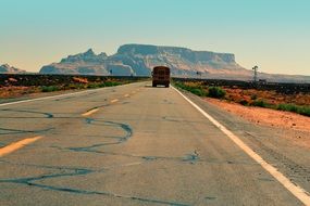 School bus on road in the desert
