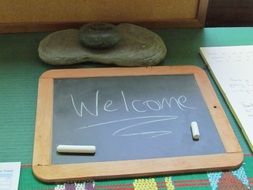 chalkboard with chalk inscription welcome