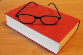 red book and glasses