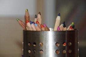 color pencils in a pen holder