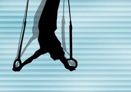 silhouette of a gymnast on the rings