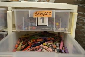 multi-colored children's crayons in a box