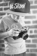 small boy with camera