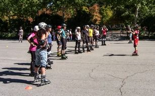 Students learning roller-skating with instructor