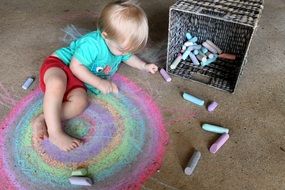 child with colorful crayons