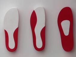 three insoles from sneakers
