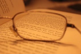 eye glasses on the opened book