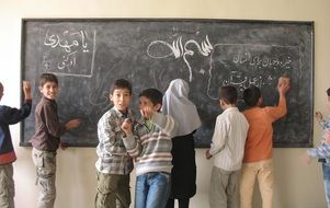 muslim childreen at blackboard