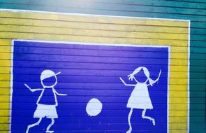 drawing on the wall in the form of playing children