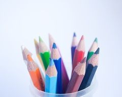 colored pencils in plastic container