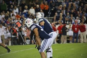 the players on the football field in America