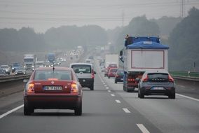 traffic on road in mist